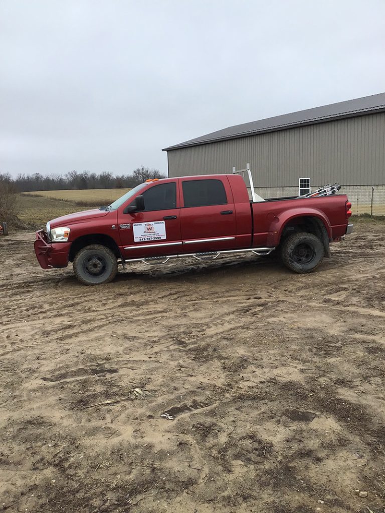 Triple W Roofing service truck at a property in Southern Indiana
